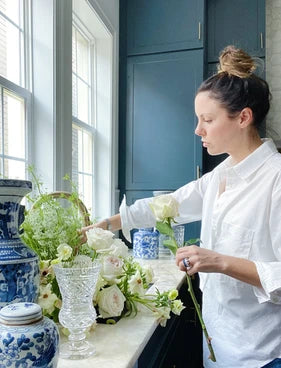 New Orleans home decor, vintage crystal vases, blue and white ginger jars, fresh flowers, navy kitchen 