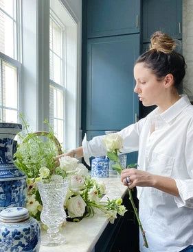 New Orleans home decor, vintage crystal vases, blue and white ginger jars, fresh flowers, navy kitchen