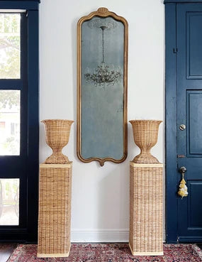 New Orleans home decor, house of modern vintage, wicker urn and pedestals, antique mirror, vintage brass and crystal chandelier