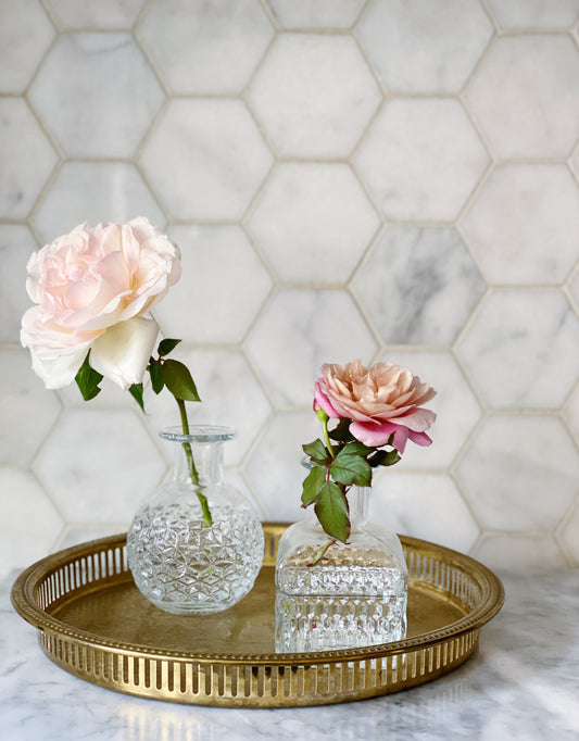 vintage brass drink tray with crystal bud vases of garden roses