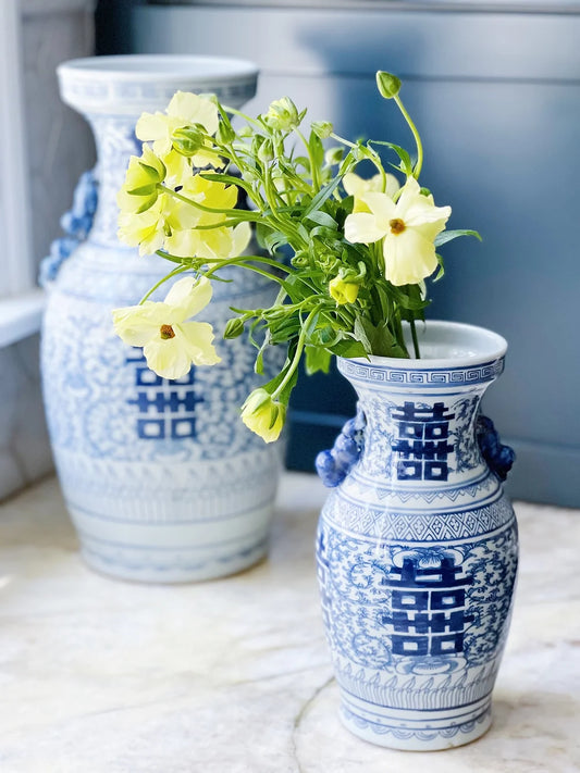 blue and white double happiness vases with yellow flowers