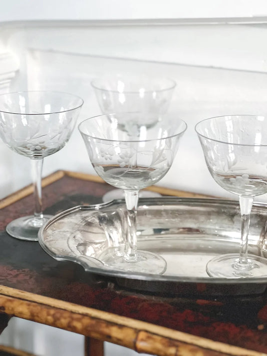 vintage etched champagne coupes in a vintage silver tray