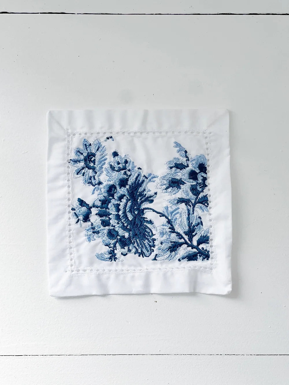 blue and white embroidered cocktail napkin