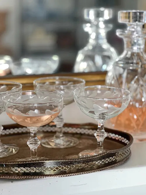 vintage etched champagne coupe glasses in a vintage drink tray 