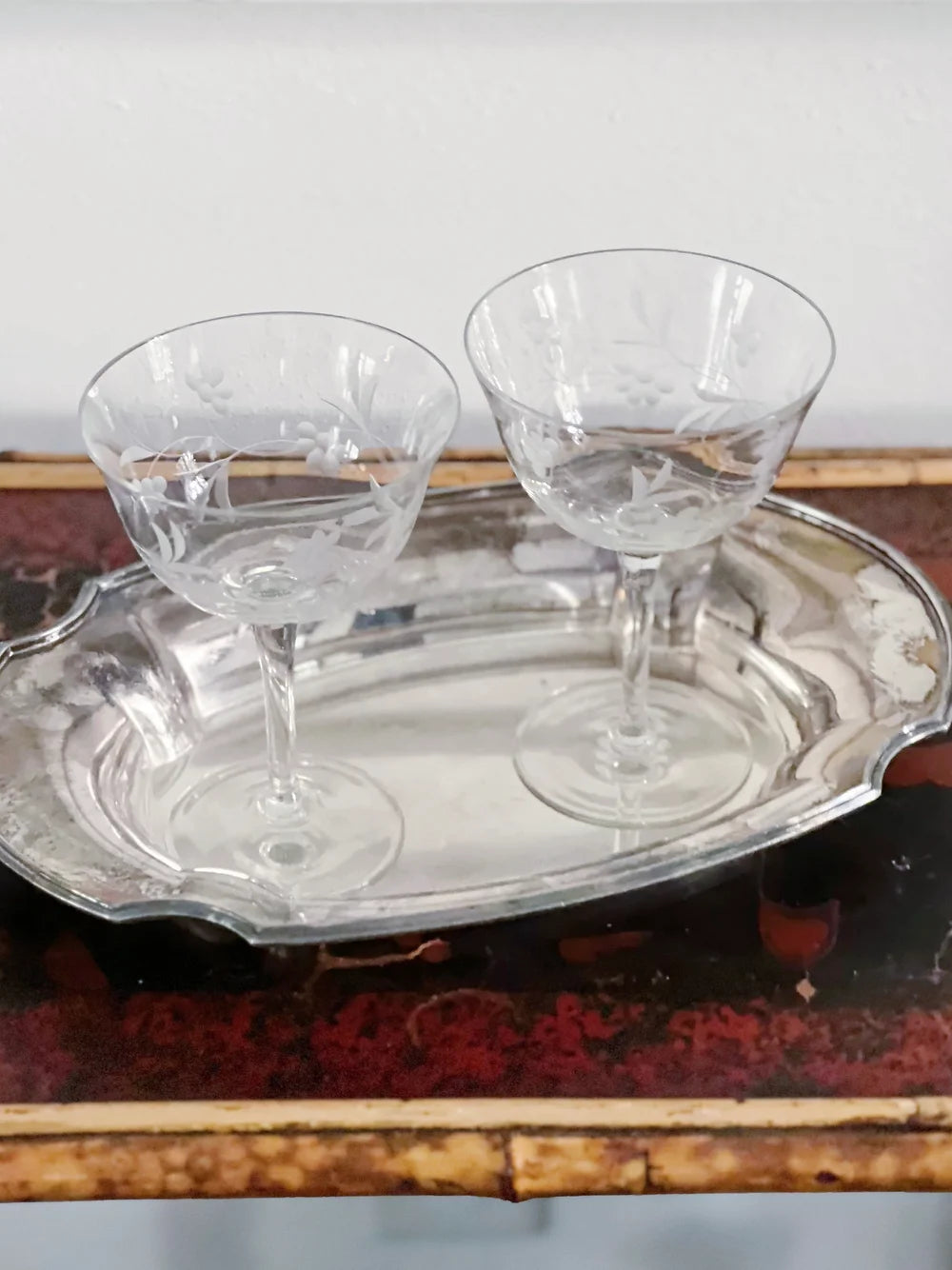 vintage etched champagne coupes on a vintage silver tray 