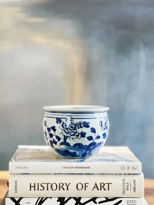 blue and white fishbowl planter