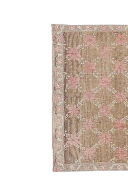 pink and tan vintage oushak rug