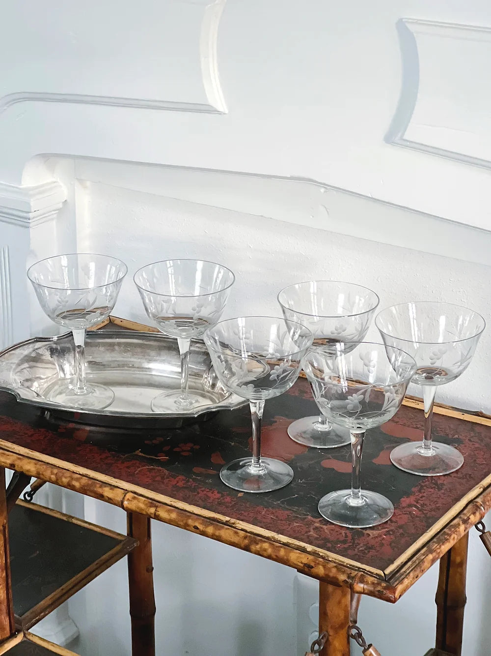 vintage etched champagne coupes on a vintage silver tray 