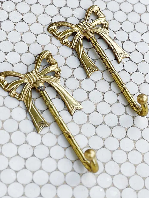 pair of vintage brass bow hooks