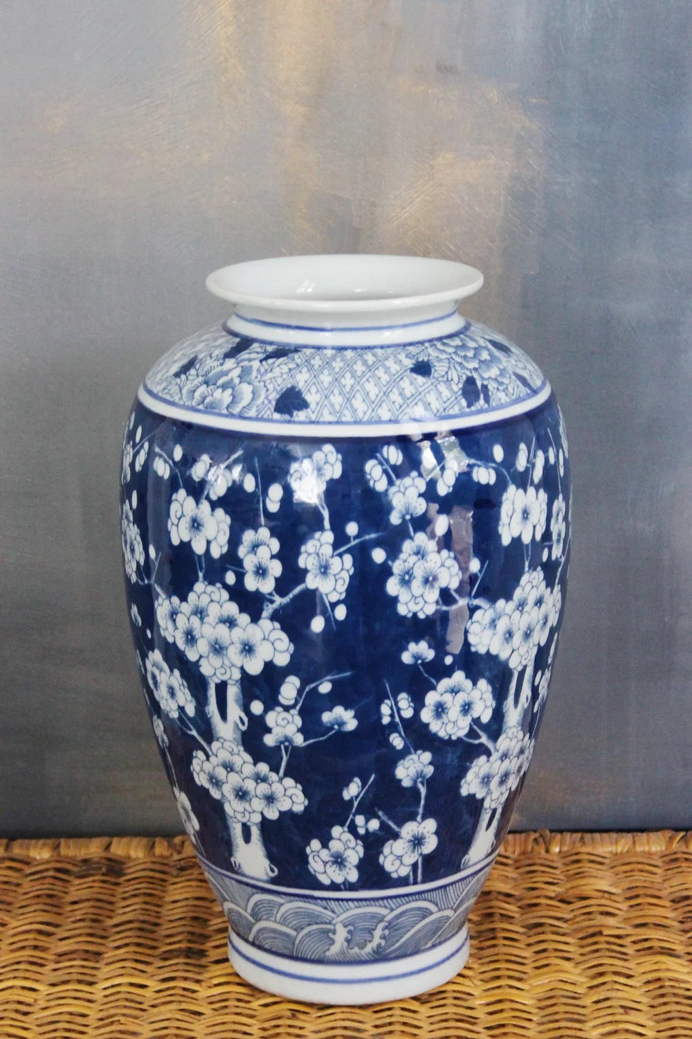 blue and white large plum blossom vase won a wicker pedestal