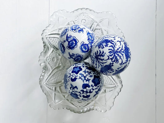 blue and white carpet balls in a vintage crystal dish 