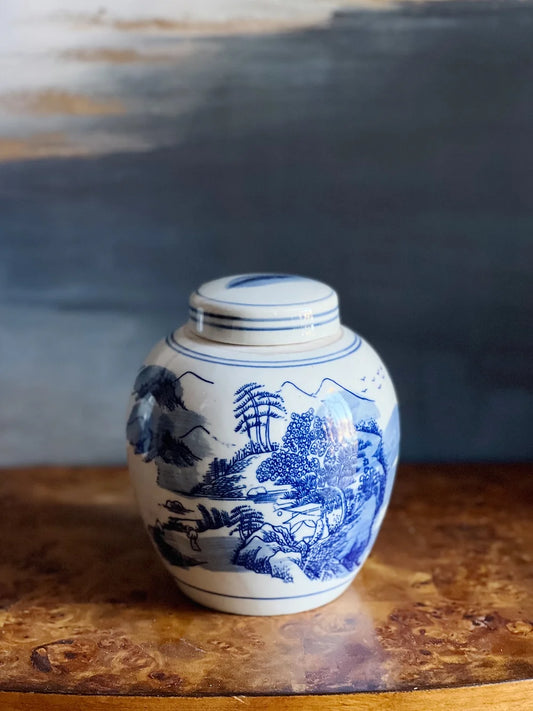 blue and white ginger jar with landscape design