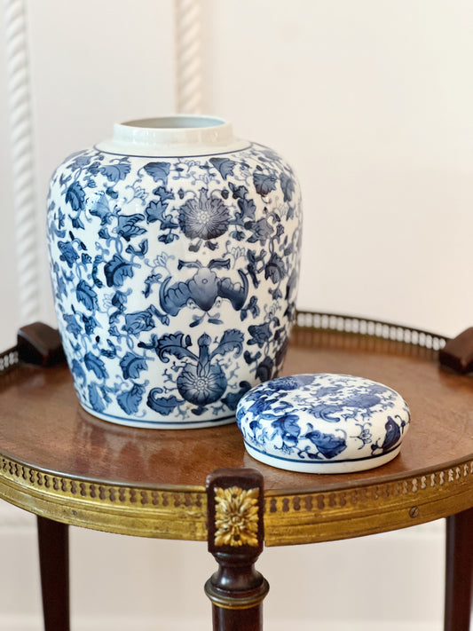 scrolling peonies blue and white ginger jar with lid off on wooden table