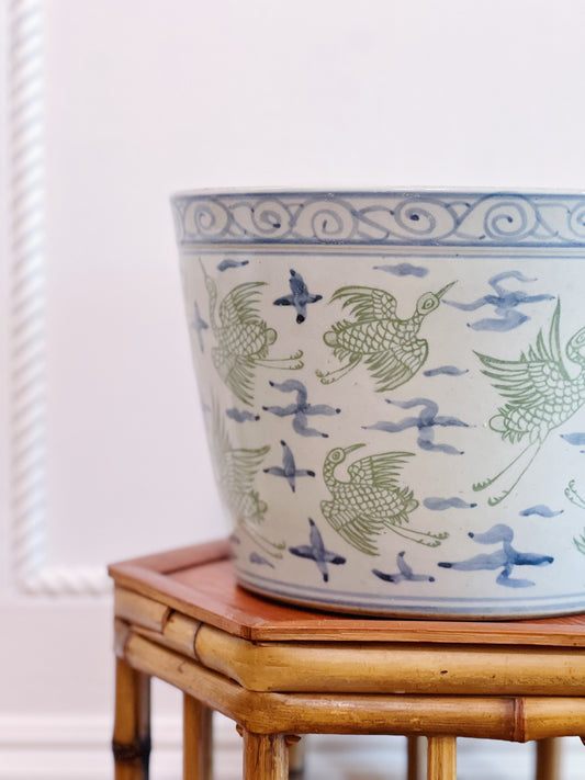 Green and blue crane porcelain planter on vintage bamboo plant stand