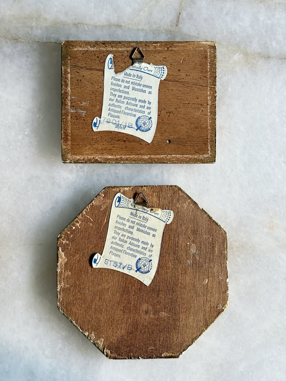 Backs of the Florentine plaques showing their Made in Italy labels