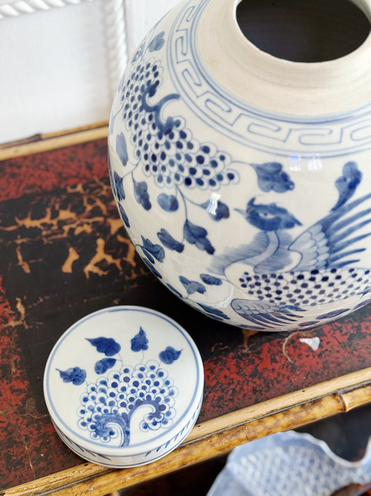 Blue and white ginger jar on vintage furniture