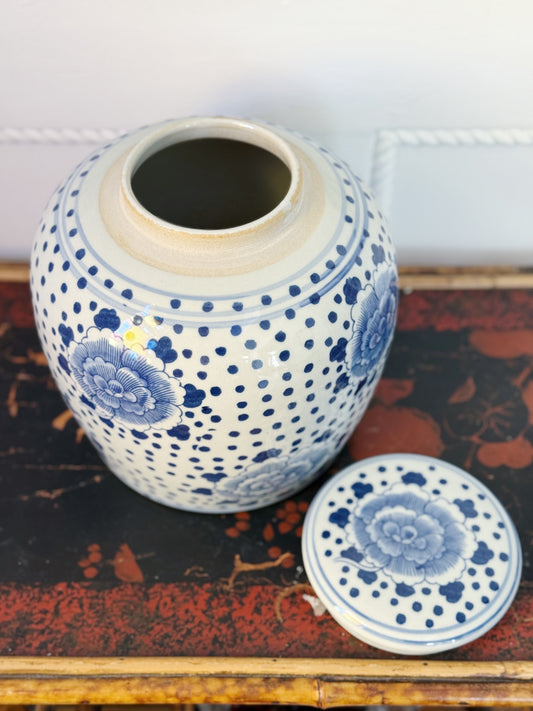 Blue and white ginger jar with peonies on it