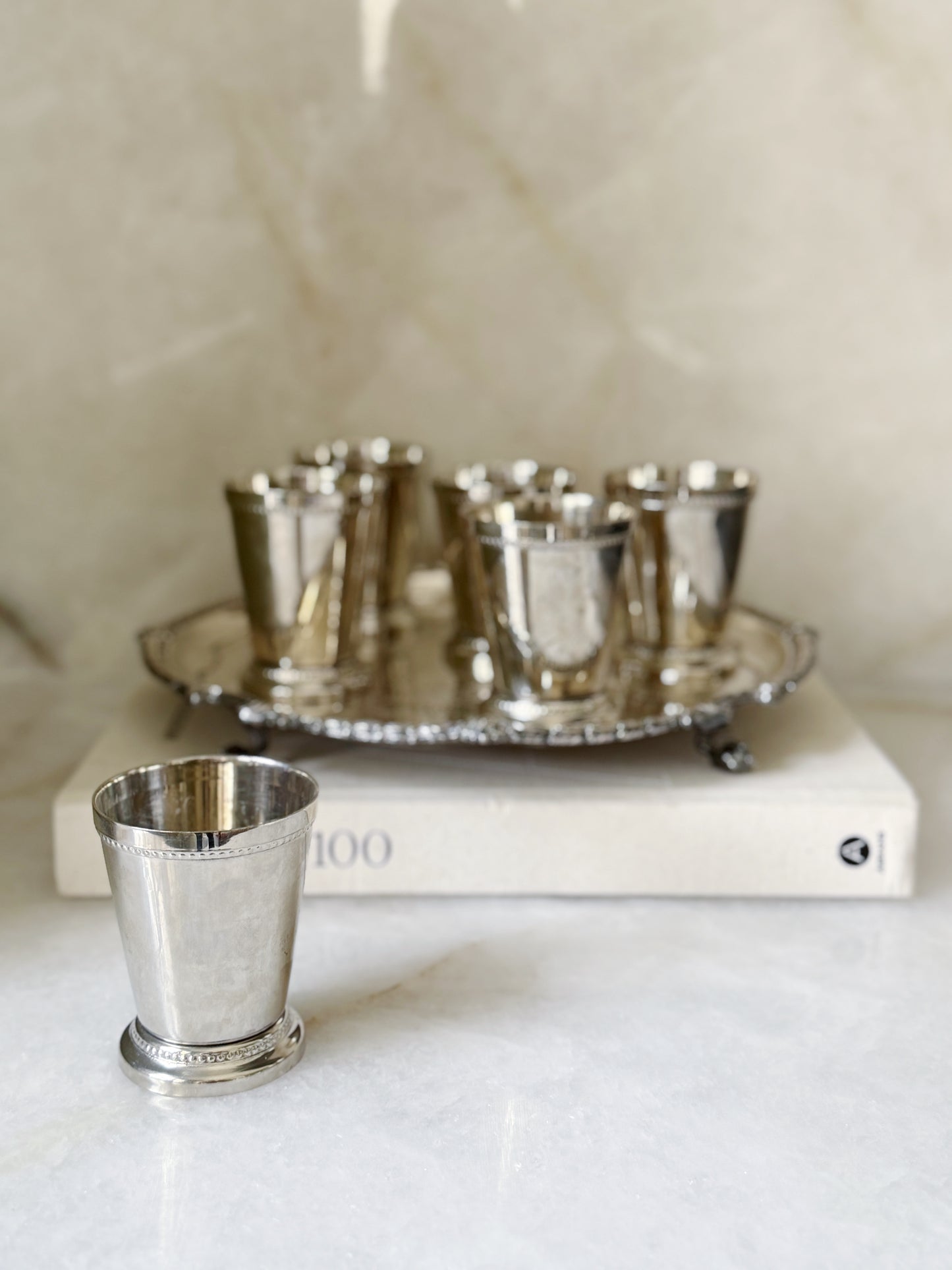 Vintage silver mint julep cups on an antique serving tray