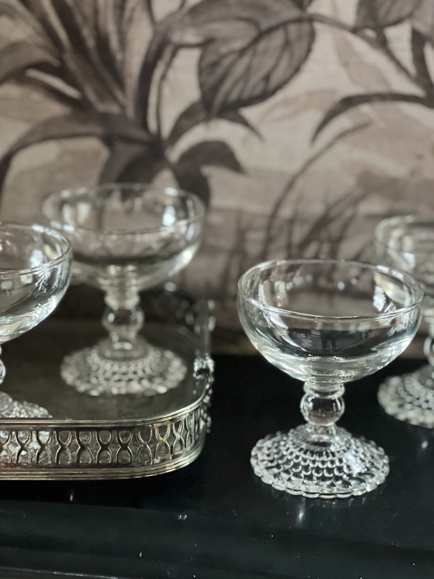 vintage anchor hocking bubble champagne coupes on a vintage silver serving tray