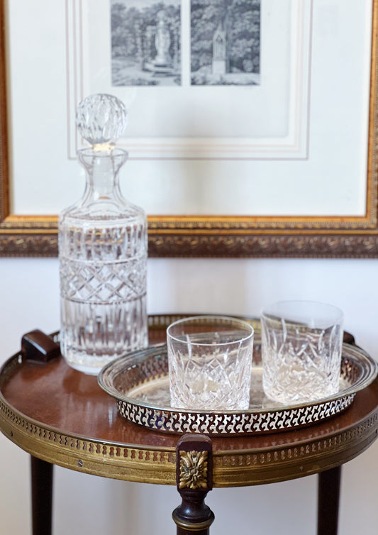 vintage crystal decanter in a vintage tray with vintage waterford tumblers