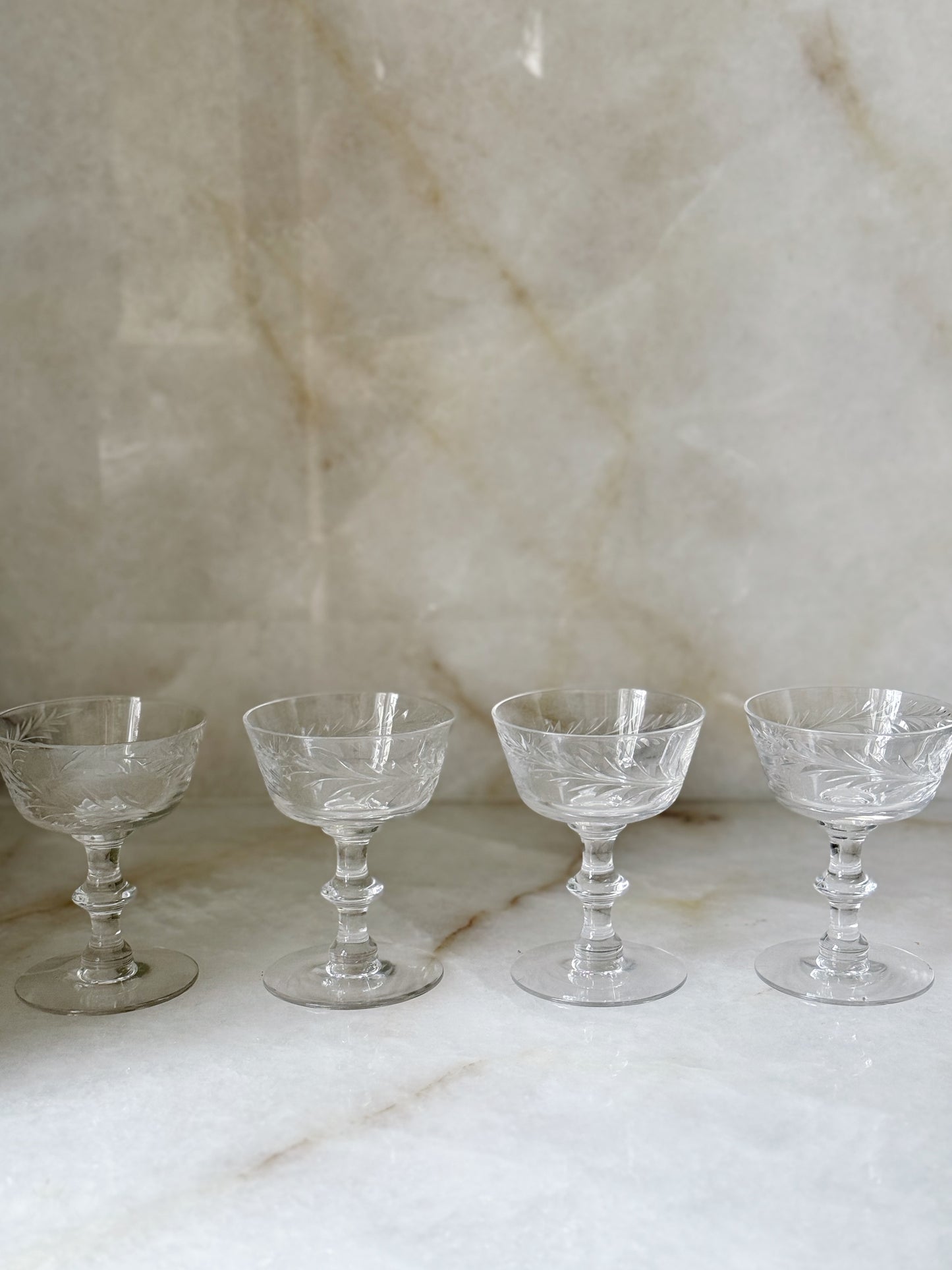 vintage glass champagne coupes with floral design