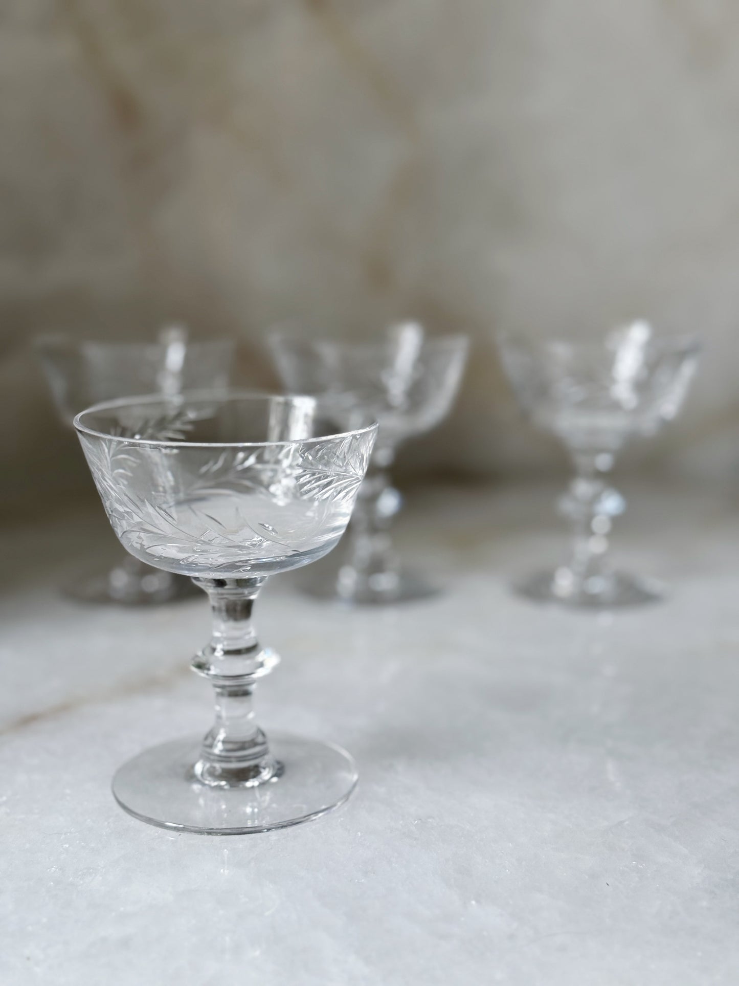 vintage glass champagne coupes with floral design