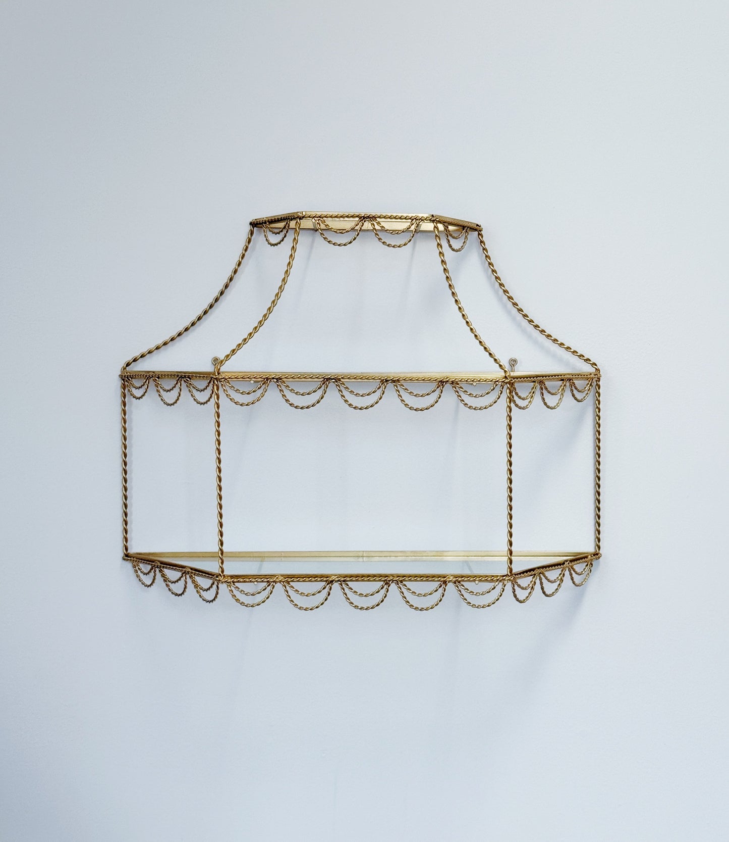 vintage Hollywood Regency gold and glass shelving with rope detail