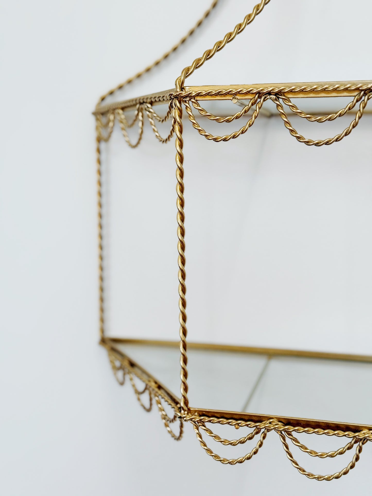 vintage Hollywood Regency gold and glass shelving with rope detail