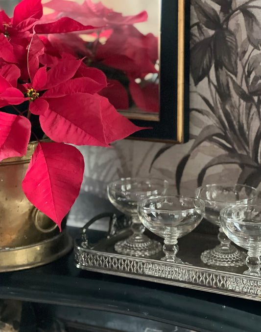 vintage anchor hocking bubble champagne coupes on a vintage silver serving tray