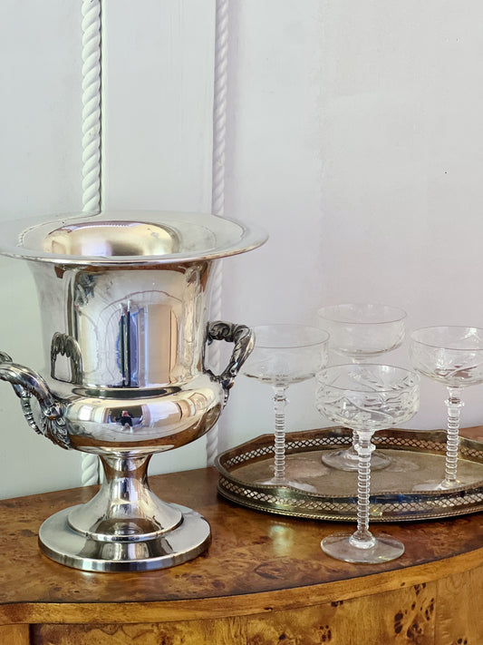 vintage silver champagne bucket with etched vintage crystal champagne coupes in a vintage brass tray