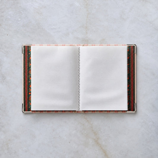 Tinsel Tree embroidered photo album open, showing photo sleeve pages
