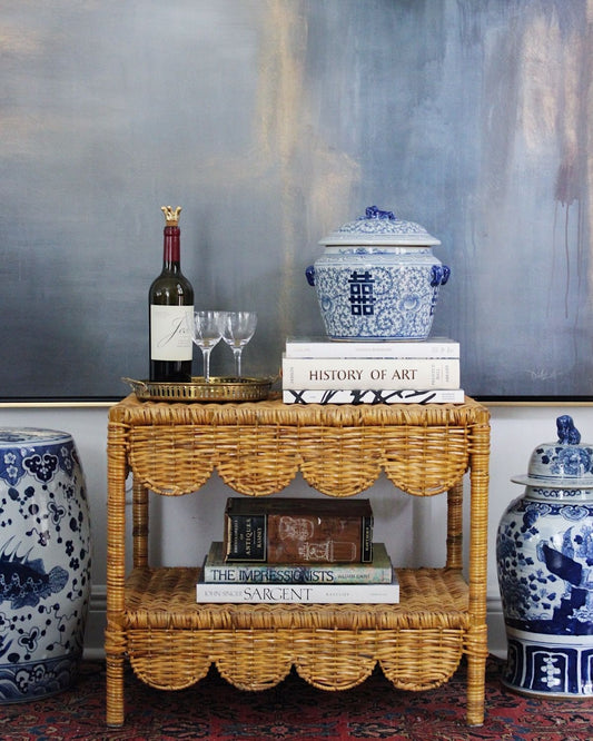 scalloped wicker coffee table, blue and white ginger jars, vintage brass drink tray