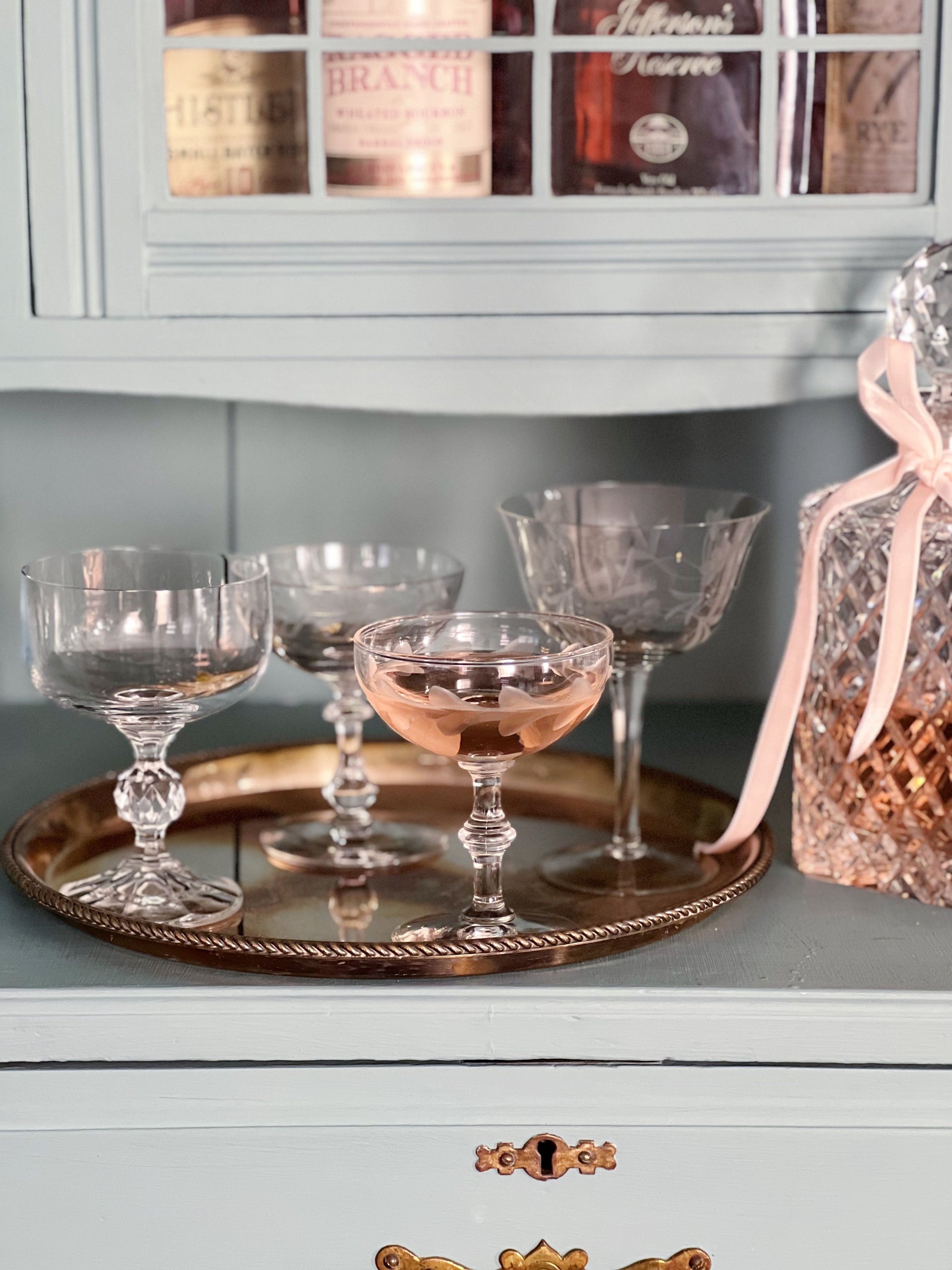 mix and match vintage champagne coupes and vintage crystal decanter