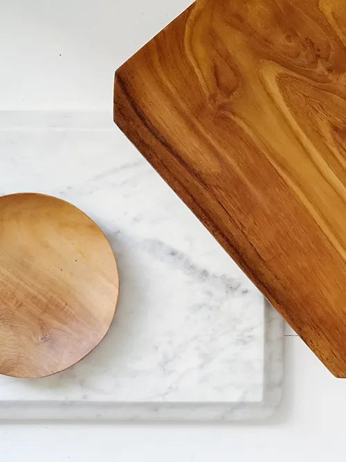 set of teak root trays and a marble tray 