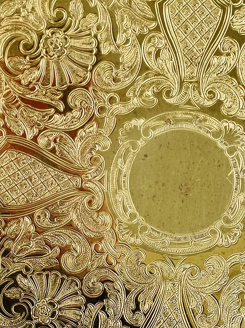 close up of vintage brass serving tray 