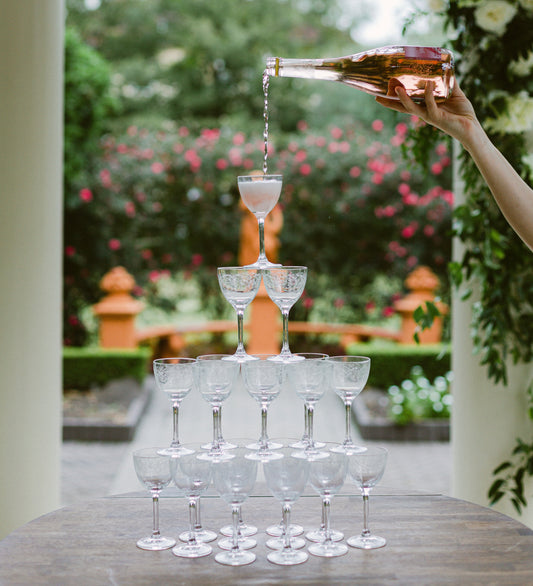 vintage nick and Nora glasses in a champagne tower at the Elms Mansion 