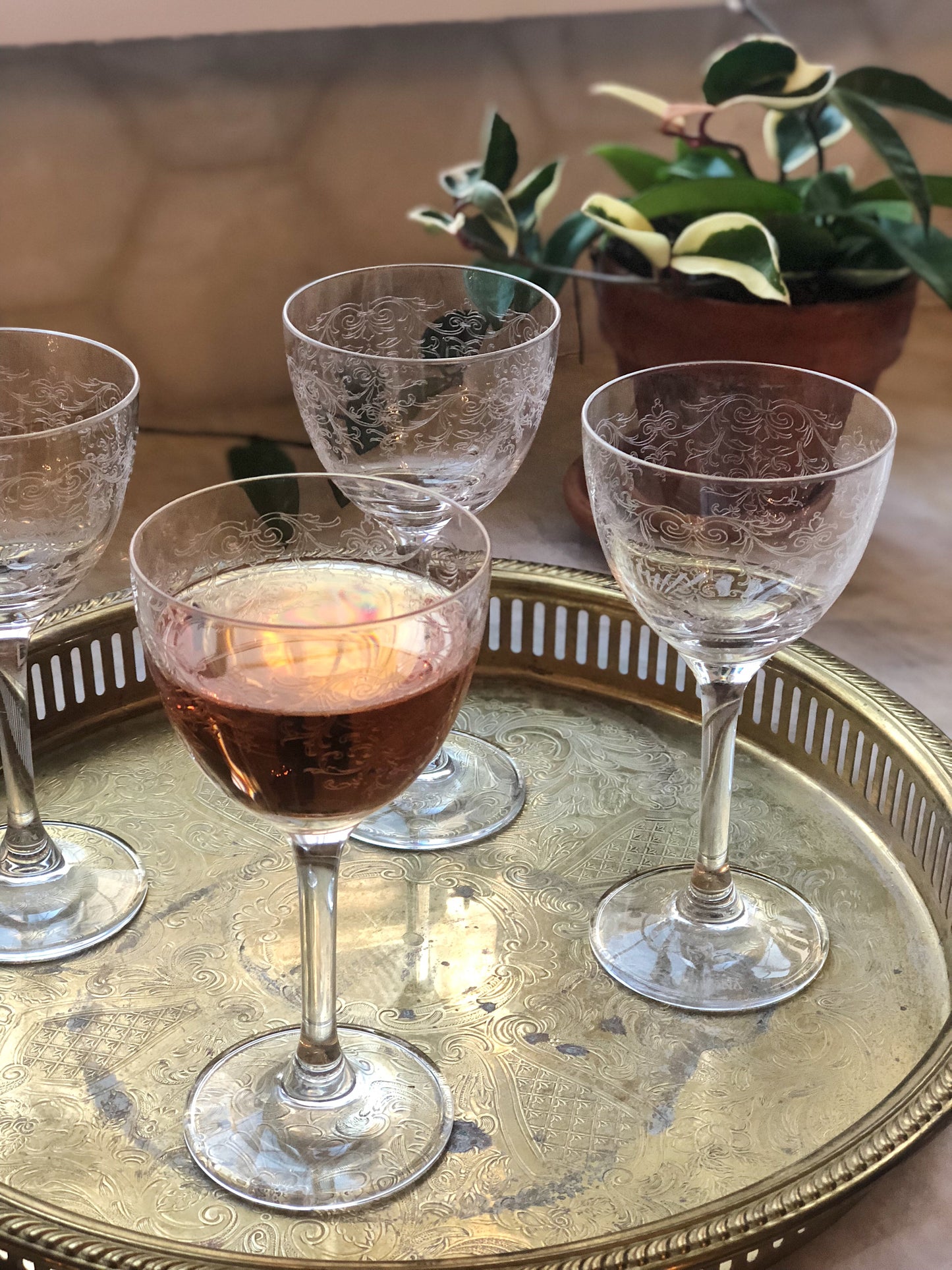 vintage nick and Nora glasses on an antique brass drinks tray