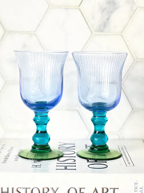 set of vintage wine glasses in purple, blue and green
