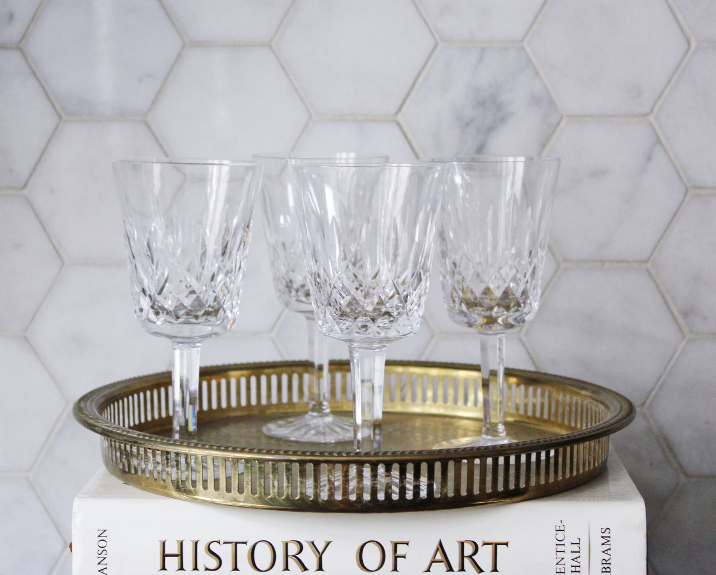 vintage waterford crystal claret glasses ona vintage brass tray