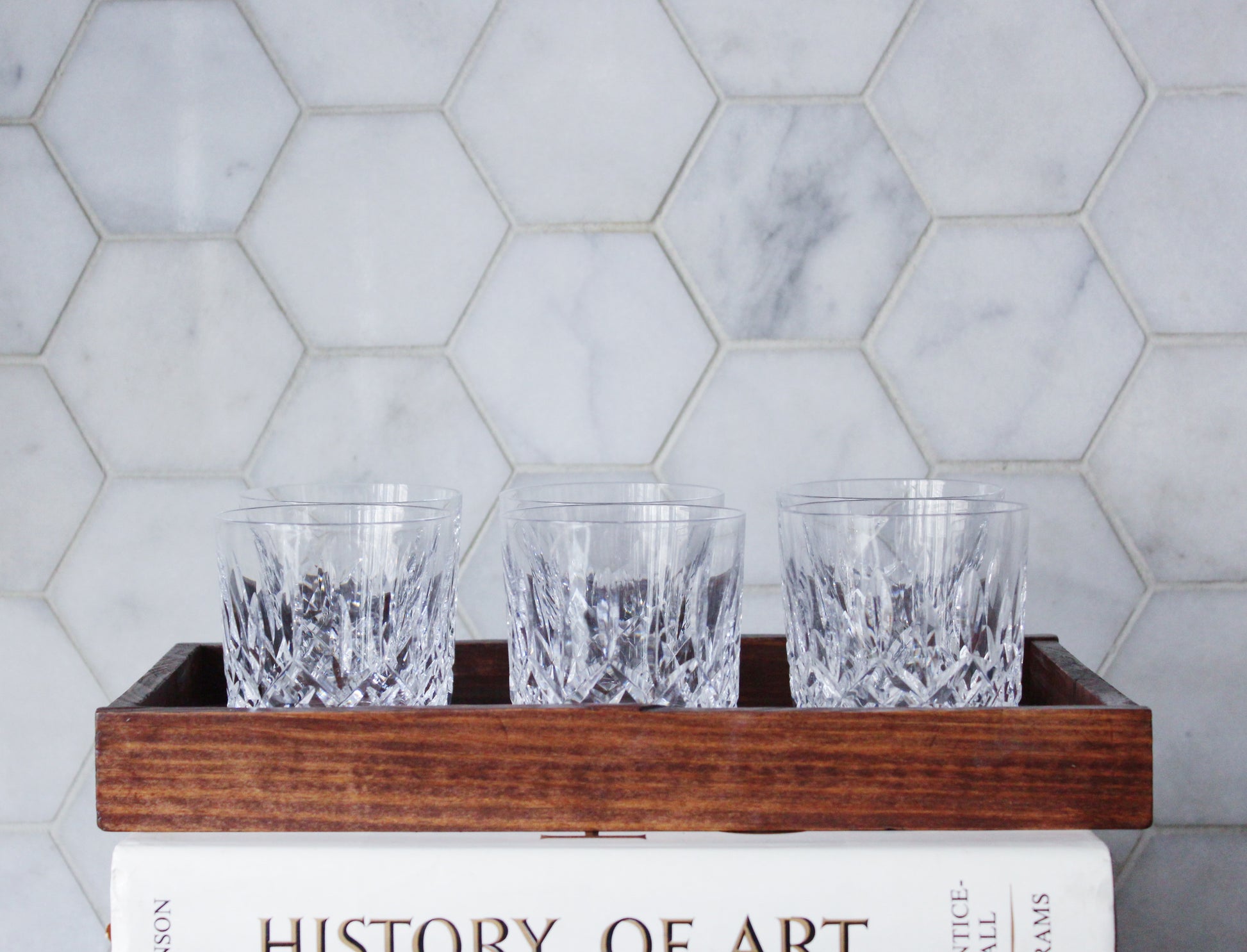 vintage waterford crystal tumbler glasses in an antique wooden tray