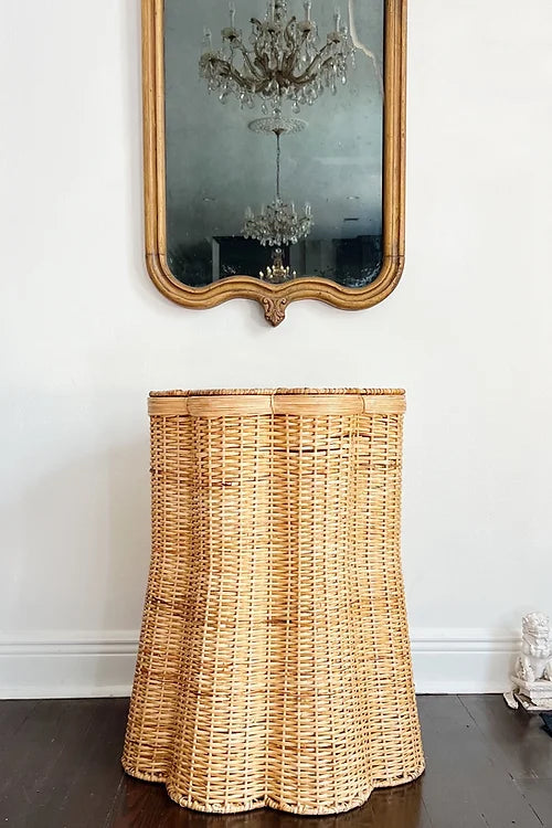 wicker scalloped storage table, new Orleans home decor, antique mirror, vintage brass and crystal chandelier