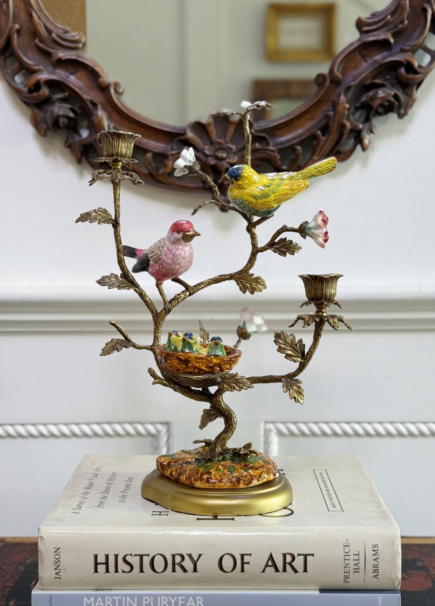 porcelain bird candelabra with bronze ormolu on vintage coffee table books