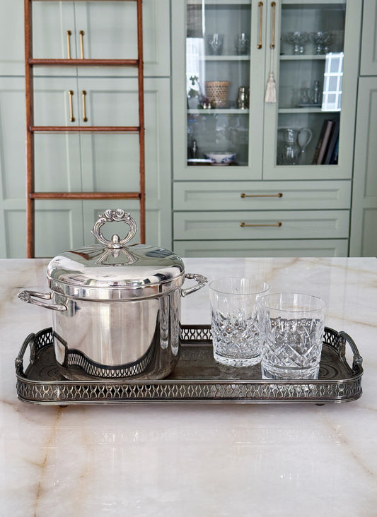 Vintage Silver-Plated Ice Bucket with Ornate Lid and Handles On a vintage serving tray with vintage Waterford crystal glasses