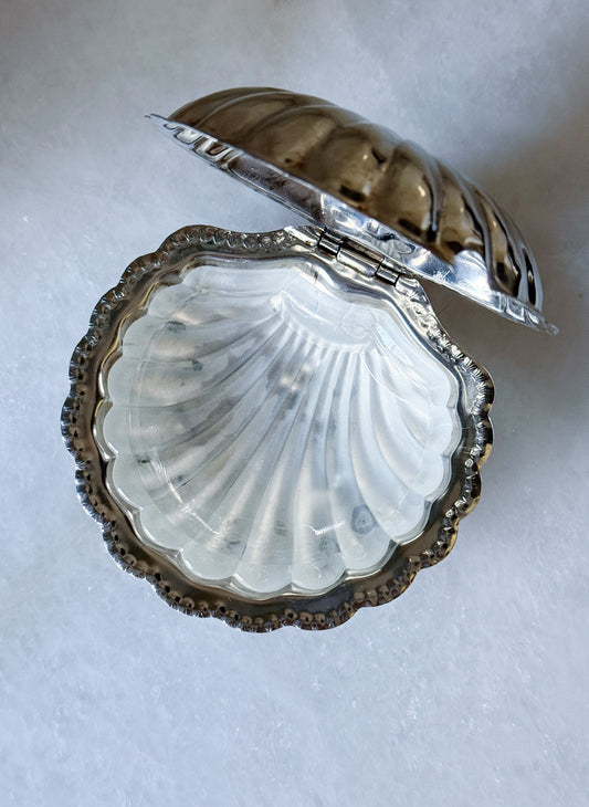 Vintage silver clamshell caviar dish open, showing the glass insert