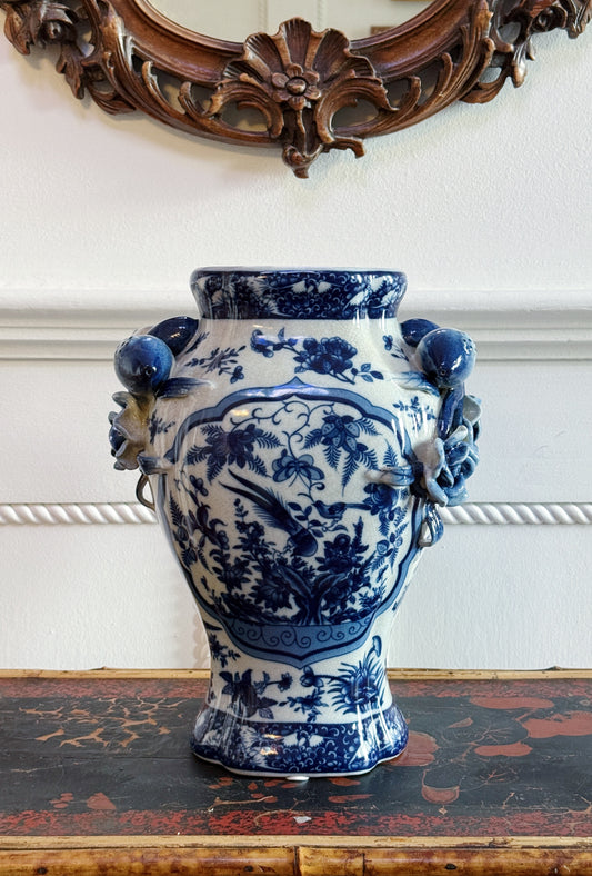Blue & White Porcelain Bird Vase with Sculptural Pomegranate Handles On a antique bamboo table with an antique walnut carved mirror above