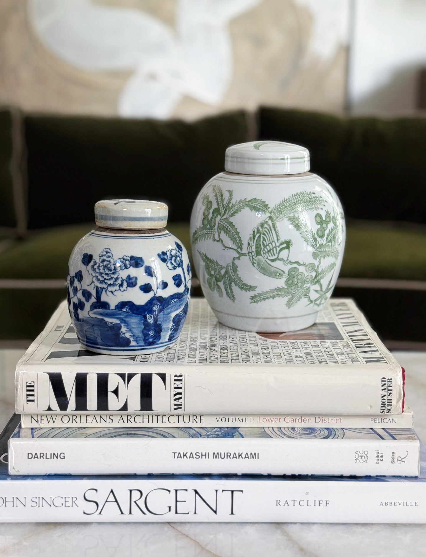 Green & White Porcelain Bird Ginger Jar In a traditional styled home with vintage coffee table books and chinoiserie 
