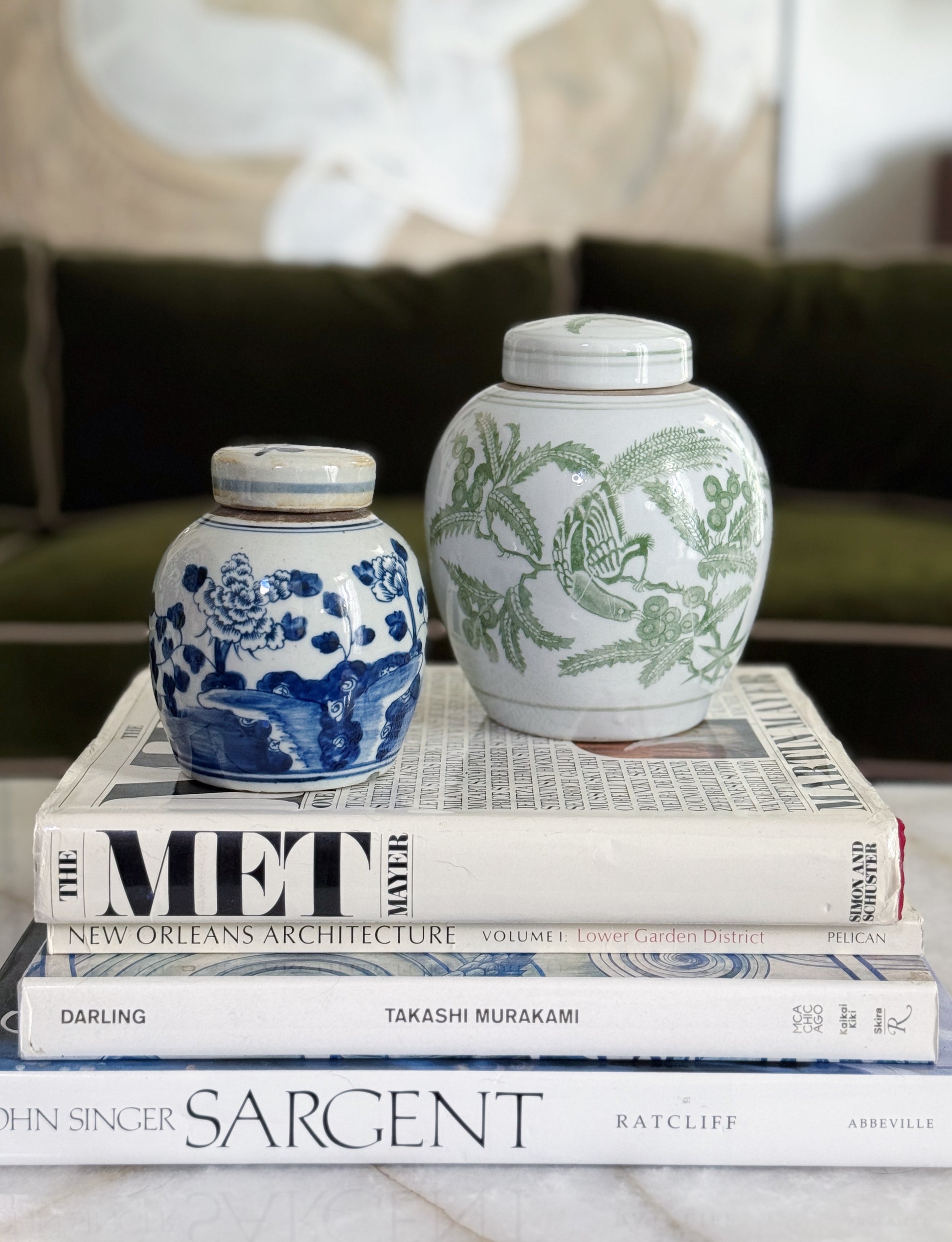 Green & White Porcelain Bird Ginger Jar In a traditional styled home with vintage coffee table books and chinoiserie 