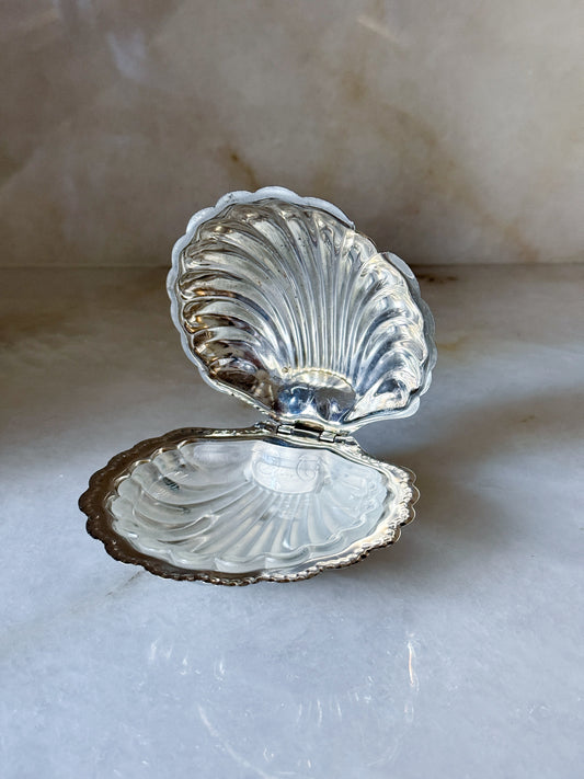 Vintage silver clamshell caviar dish open at an angle