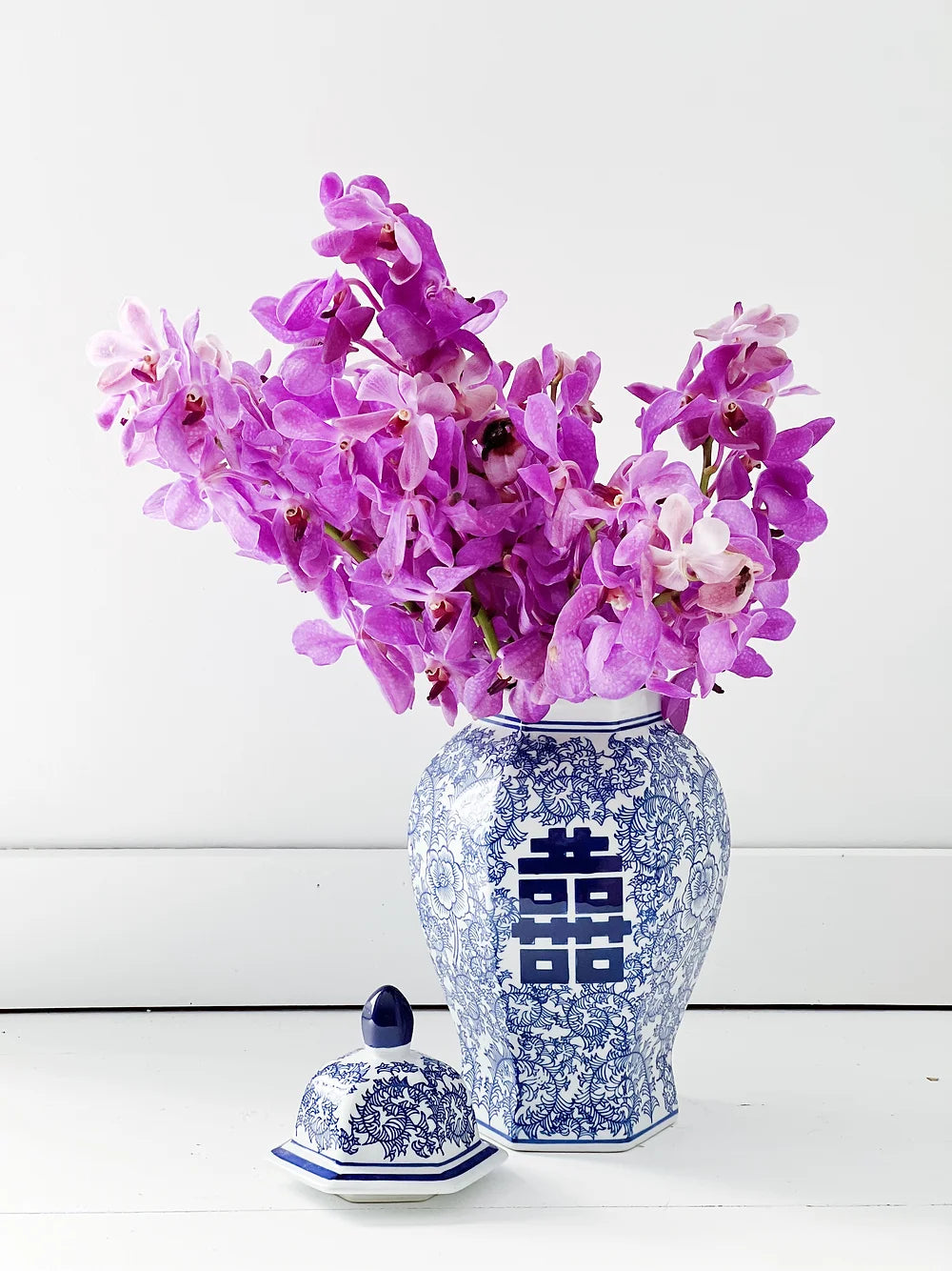 blue and white double happiness ginger jar with purple orchids