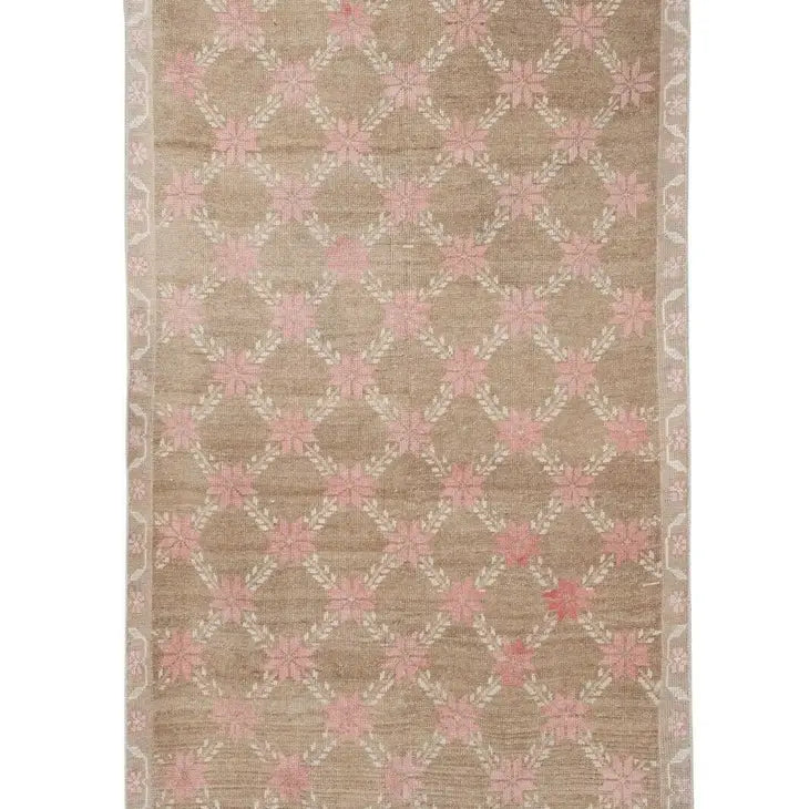 pink and tan vintage oushak rug